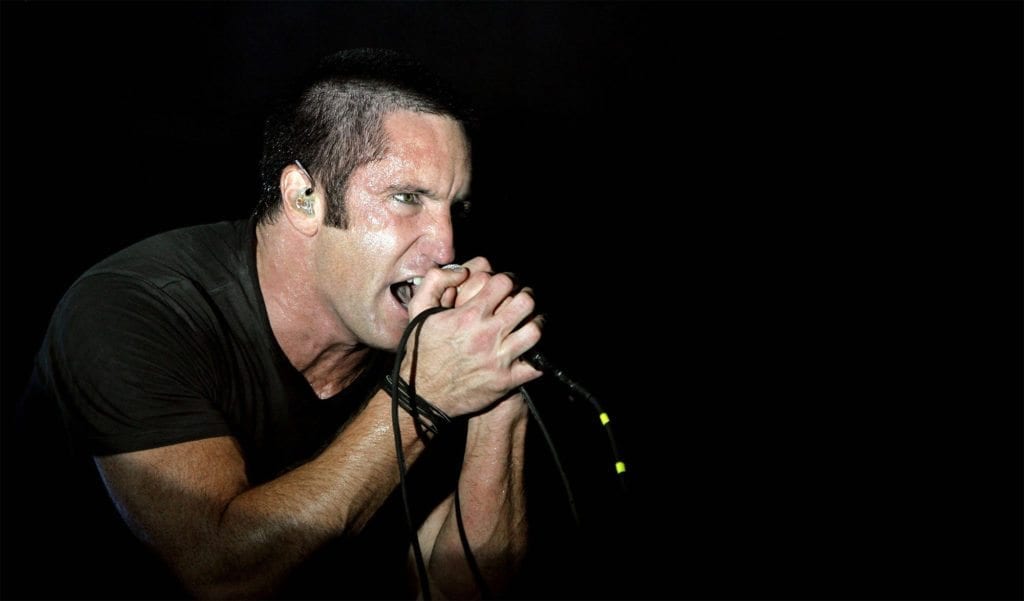 Whether it’s a show or a movie dropping a Nine Inch Nails song into the soundtrack at a pivotal moment of the story or Reznor himself showing up on set to perform, Reznor’s musical moments are always iconic. Here’s our ranking of Reznor’s ten greatest on-screen musical moments.