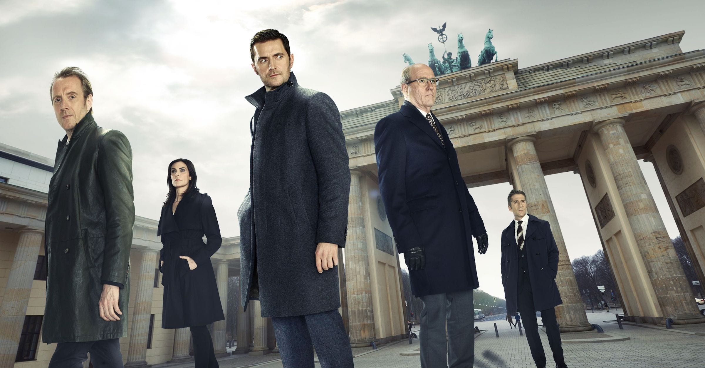 Richard Armitage (Ocean’s 8) stars as a CIA analyst who turns to a career of undercover work for the foreign station in Berlin.