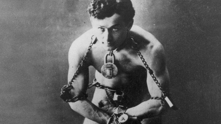 Erik Weisz, known by his stage name Harry Houdini, wowed audiences with his illusions & insane stunts. The details of his strange death will shock you.