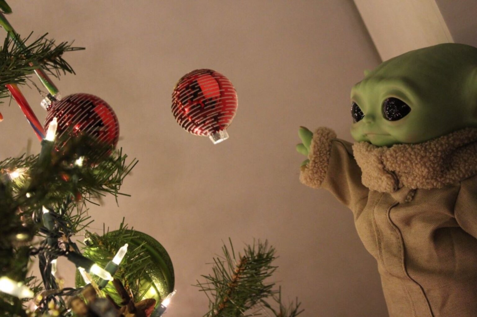 The smiling baby Yoda is the hottest Christmas tree topper in 2020. See how 'Star Wars' fans celebrate the holiday season with baby 'Grogu'.
