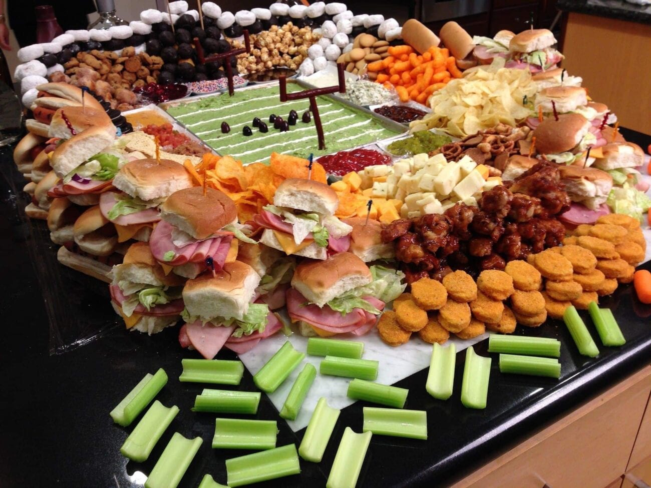 Yeah, sure, the Super Bowl is cool. But everybody knows the star of your party is the food. Score a touchdown with these football snacks staples!