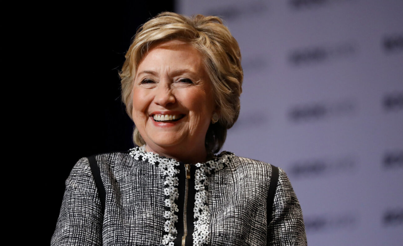 Hillary Clinton is penning a new book, and it's going to be a mystery. Dive into the synopsis of Clinton's new project right here.