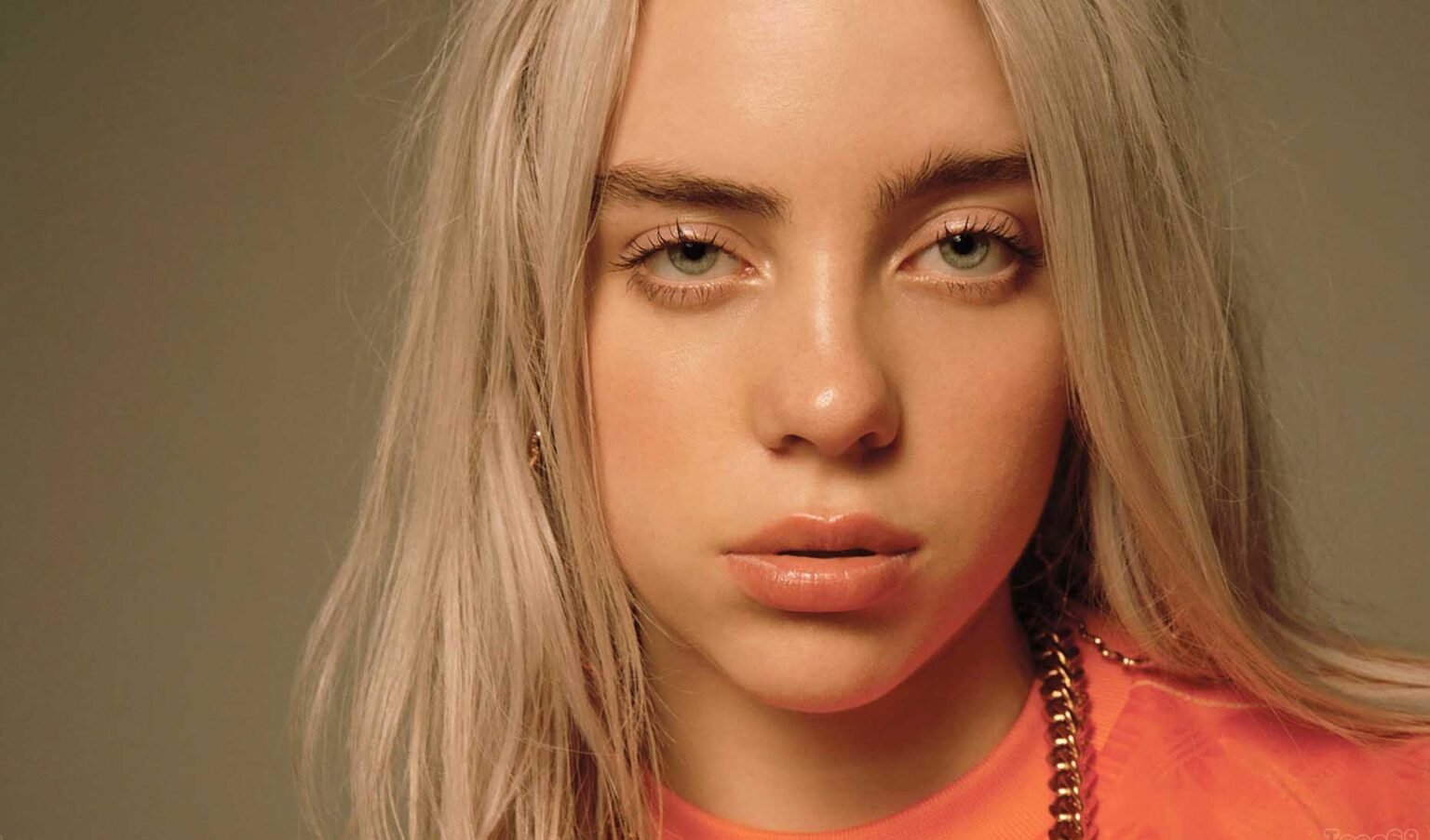 Billie Eilish has swapped out her iconic black & green hair for a bright blonde do. Does this change signal an "end of an era" for songs to come?