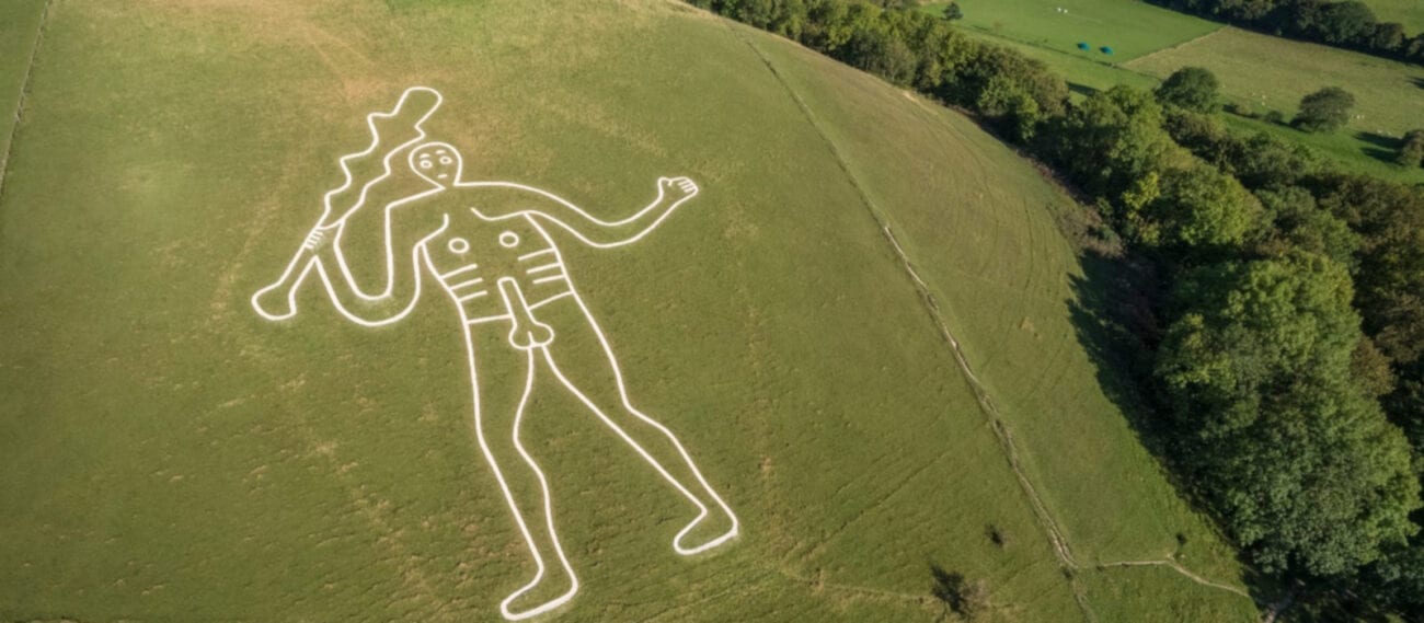 Has the mystery behind the Cerne Abbas giant finally been solved? Discover all the theories about this bizarre carving in a hill.