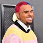 After Chris Brown reportedly struck another woman, we're wondering why he's still a thing. Catchy songs? Take a closer look at why he's not canceled.