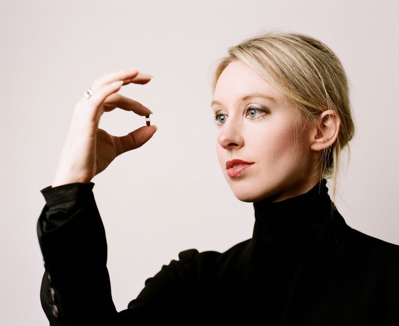 Who is Elizabeth Holmes? The answer has changed drastically in just a few years. Is she a genius, a fraud, or a victim? Dive into the details.