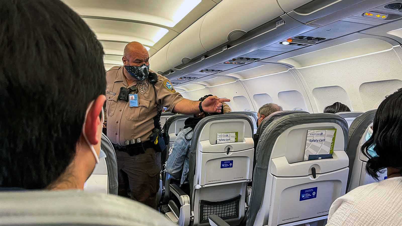 Frontier airline passenger ducttaped to seat Review the reasons why