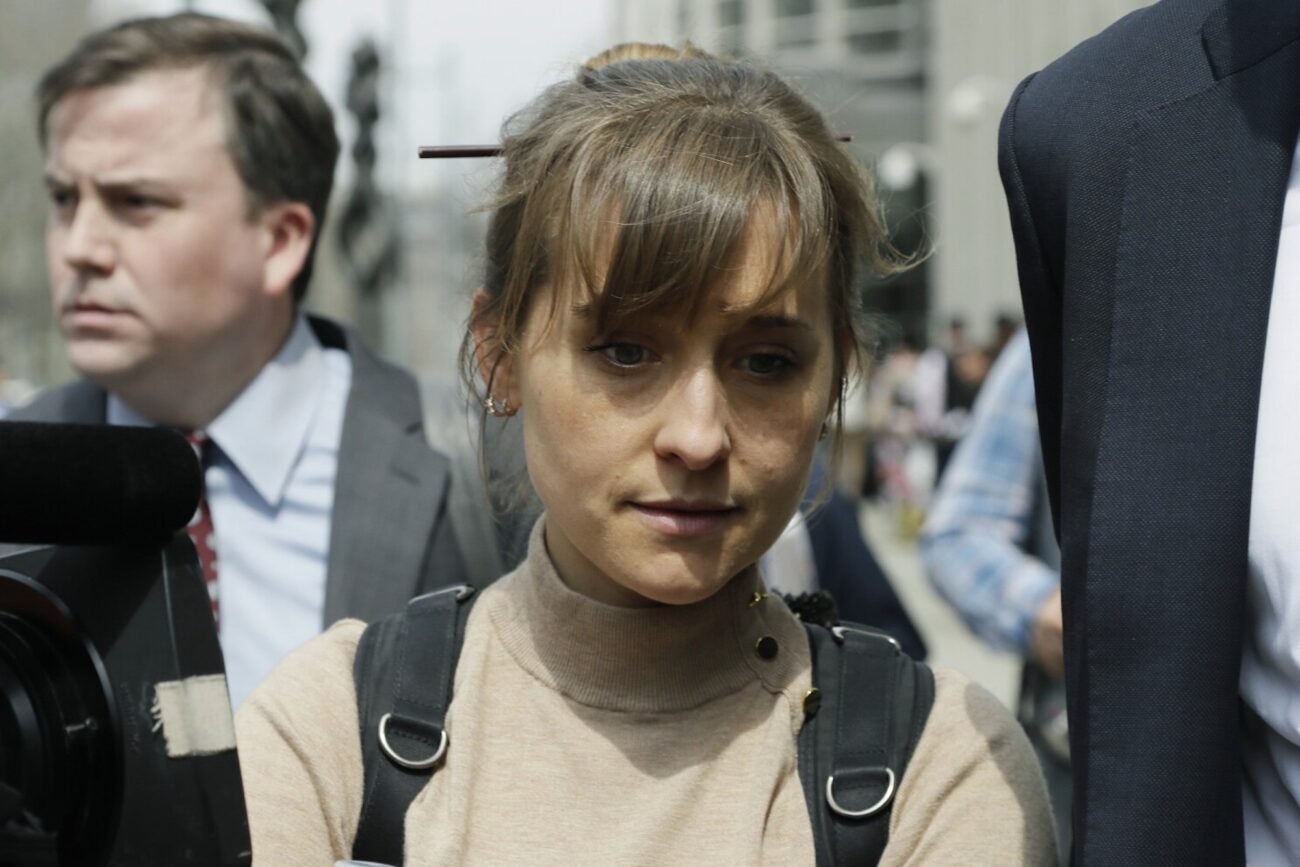 How did actress Allison Mack go from starring in 'Smallville' to leading a dangerous sex cult? See how her life turned to crime and bizarre devotion.