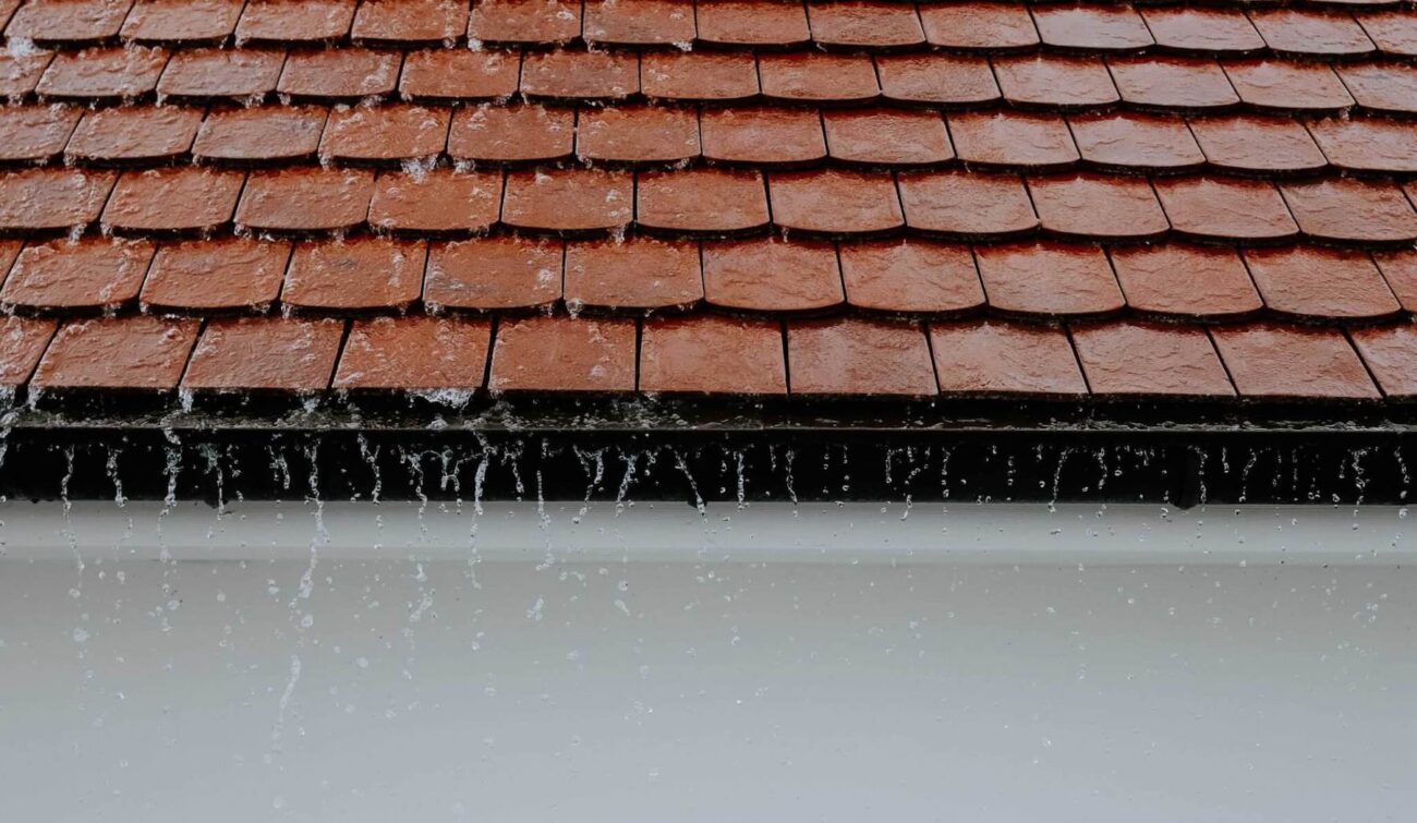 Pooling water is a problem with flat roofing since they can't drain water. It's your responsibility to take the necessary steps to prevent water pooling.